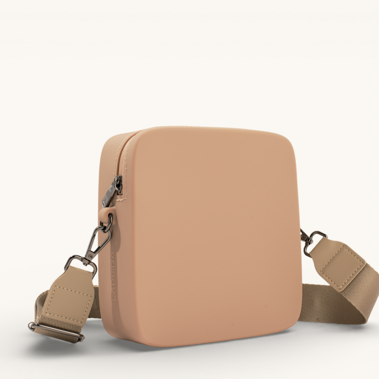 Beige Mini Quad silicone crossbody bag side view showing structured square shape